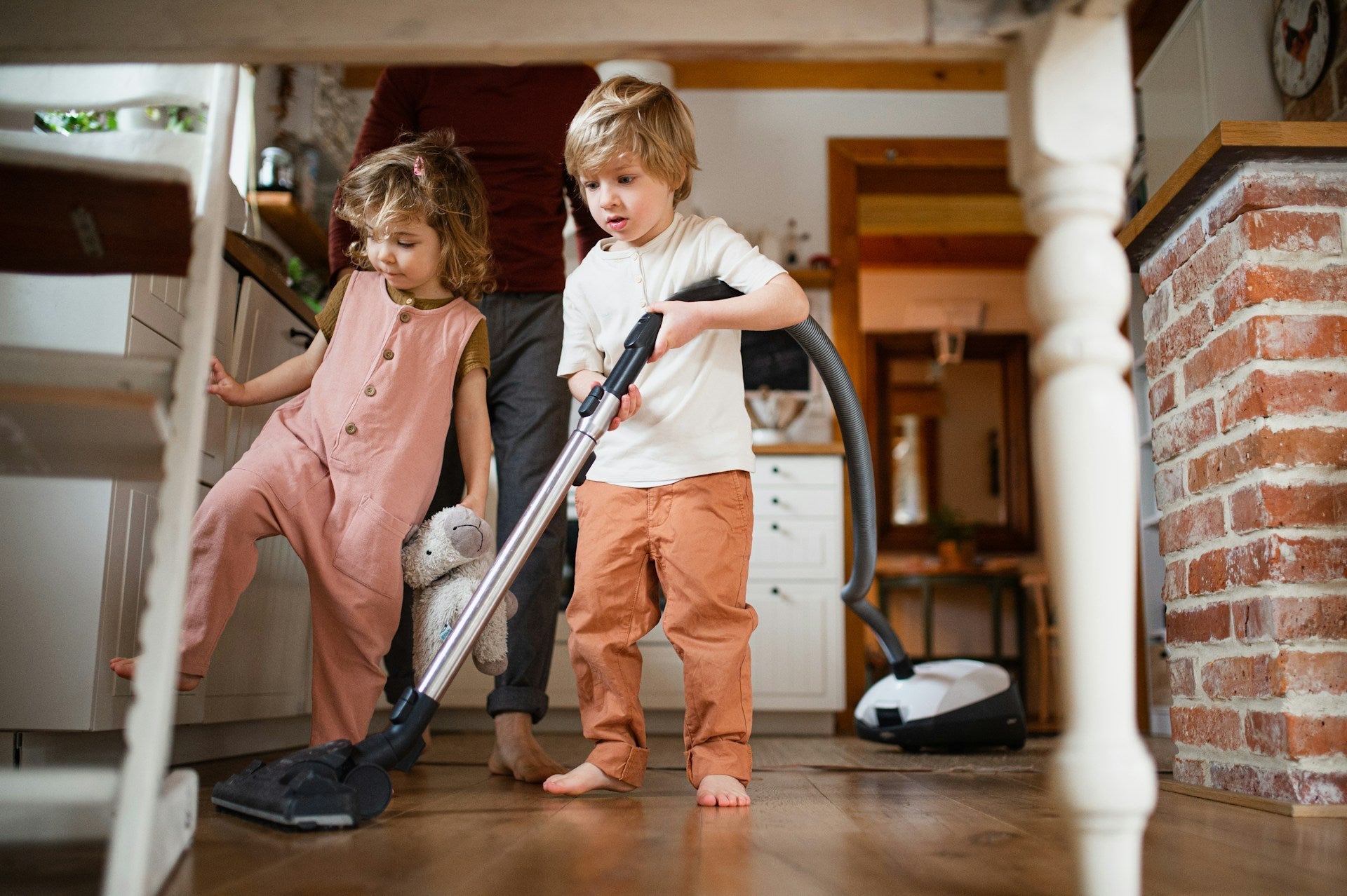 Kids helping clean at home, teaching children eco-friendly cleaning habits that stick