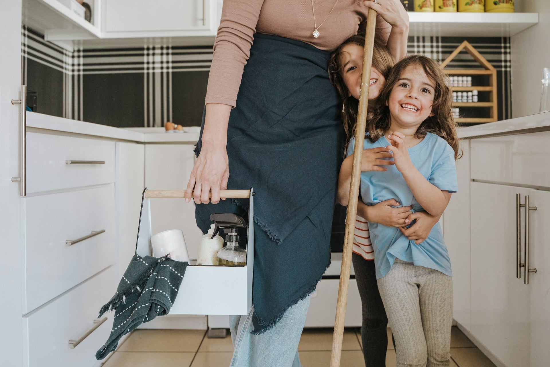 Parent and child cleaning at home with safer, plastic-free cleaners around kids and pets