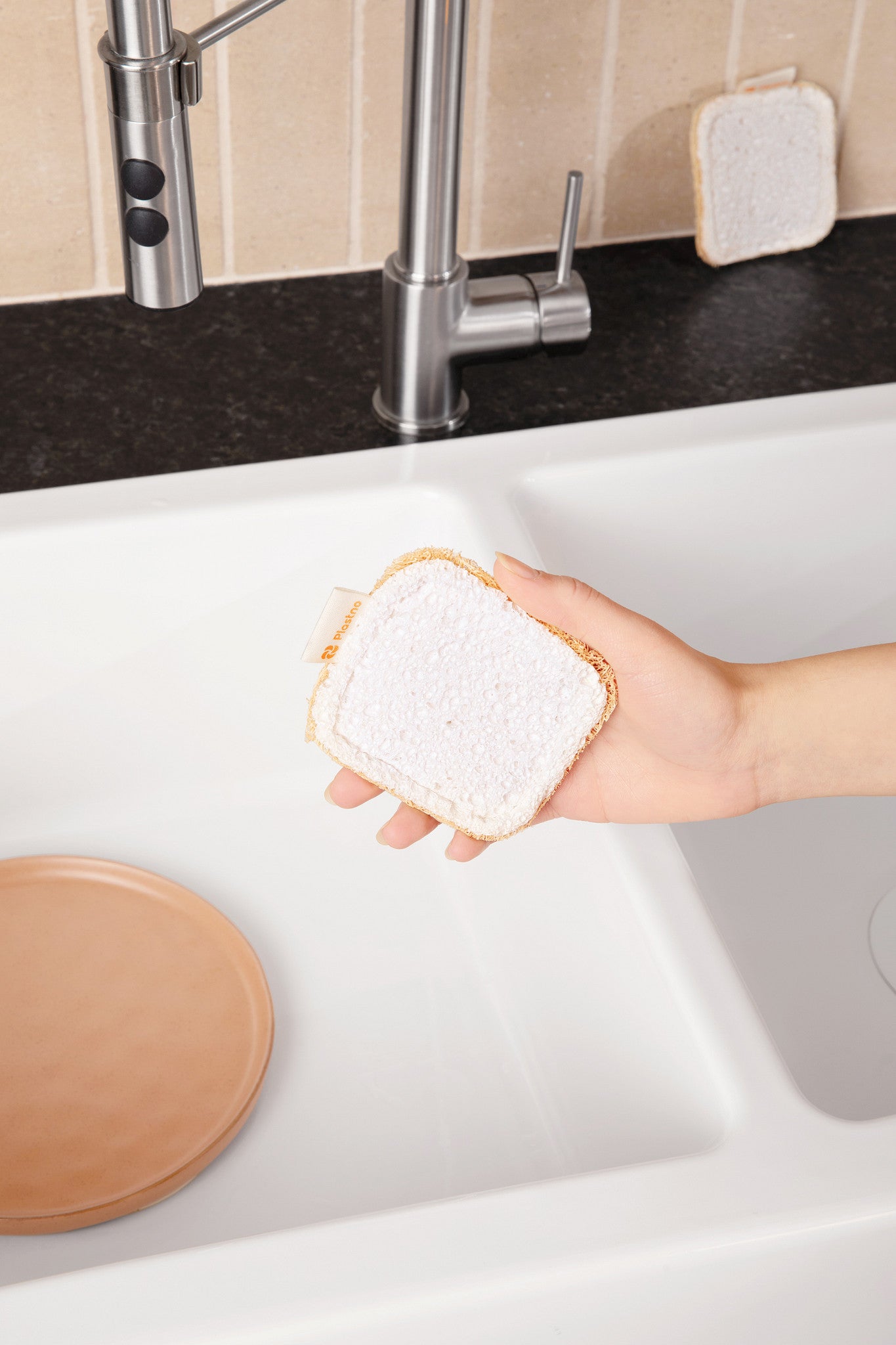 Plastno Scrub Sponge: biodegradable loofah dish sponge cleaning a kitchen sink