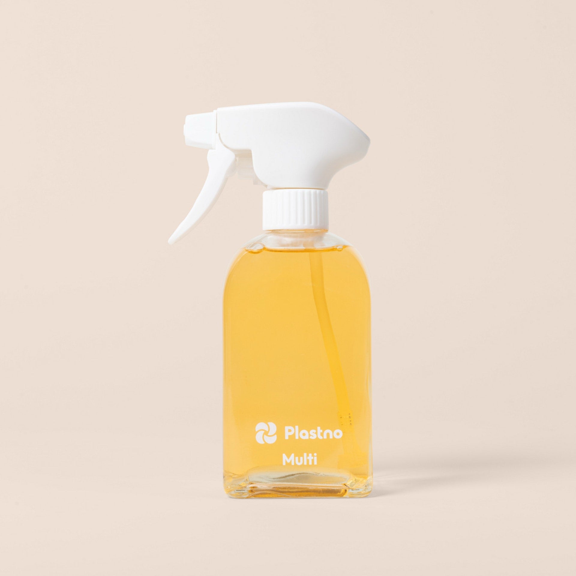 Plastno Multi cleaner glass spray bottle filled with cleaner on a beige background