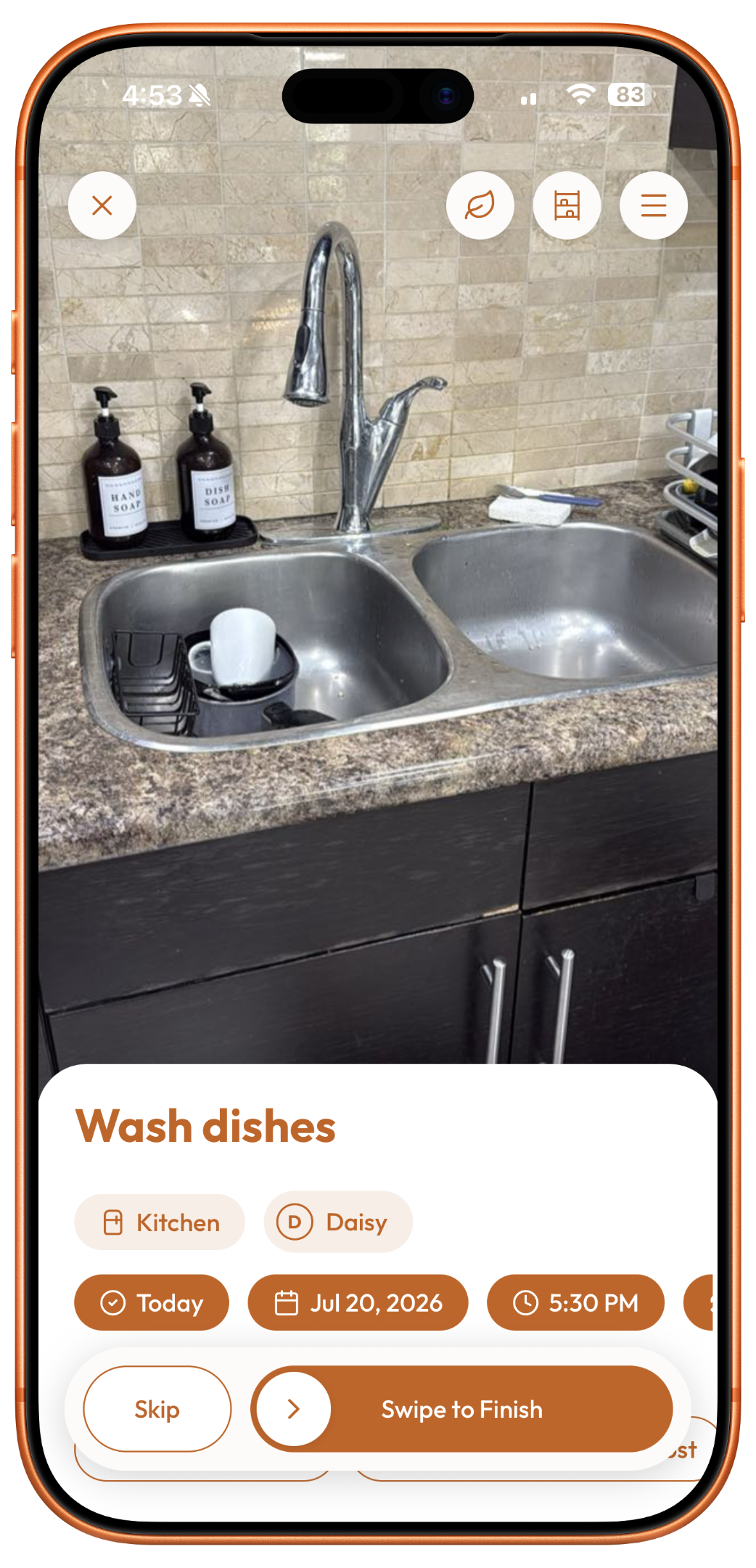 Plastnofy app chore screen on an iPhone showing a photo of a kitchen sink with the task "Wash dishes" assigned to Daisy and a swipe to finish button