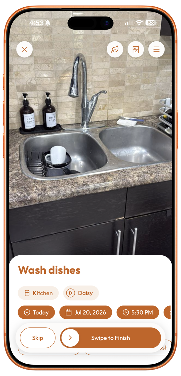 Plastnofy app chore screen on an iPhone showing a photo of a kitchen sink with the task "Wash dishes" assigned to Daisy and a swipe to finish button