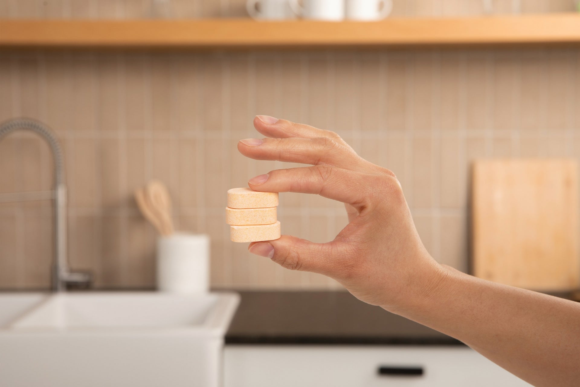 Plastno Leaping Bunny certified cruelty-free cleaning tablet dissolving in a refillable bottle