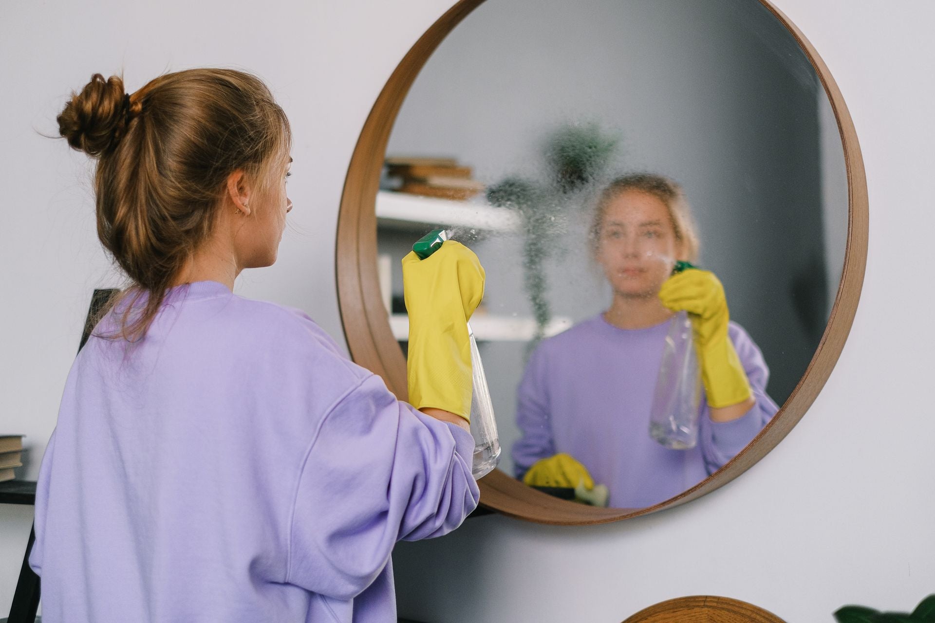 Plastno mineral-based cleaning tablets and reusable spray bottle set out for a low-waste summer travel cleaning routine