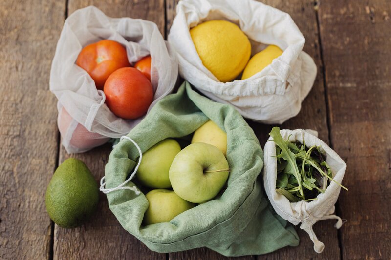 bags of fruits and greens