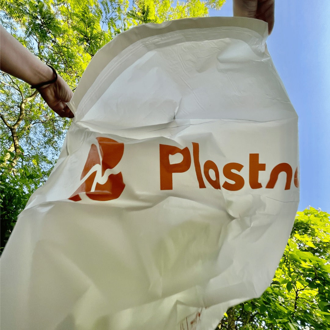 Opening a Plastno compostable trash bag