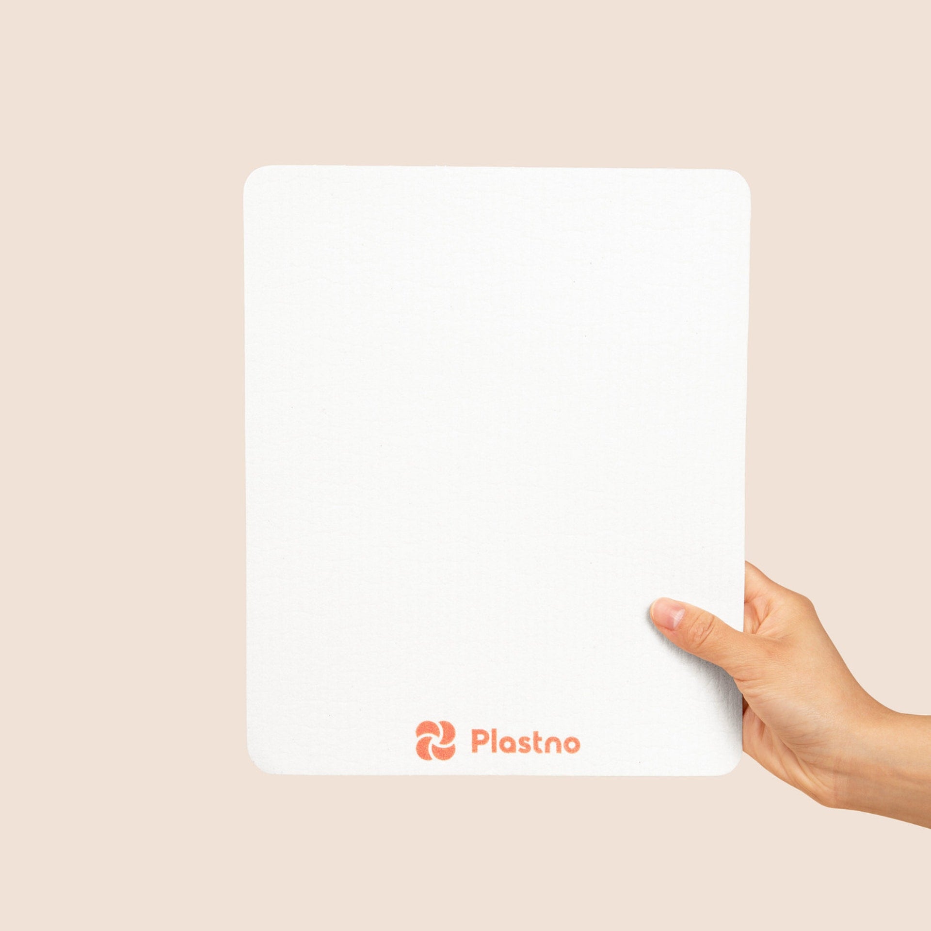 Plastno Sponge Towel wiping a kitchen counter, biodegradable paper towel alternative made from cellulose and organic cotton