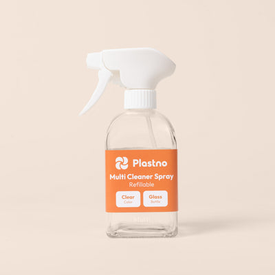 Plastno refillable Multi Cleaner Spray glass bottle with orange label on a beige background